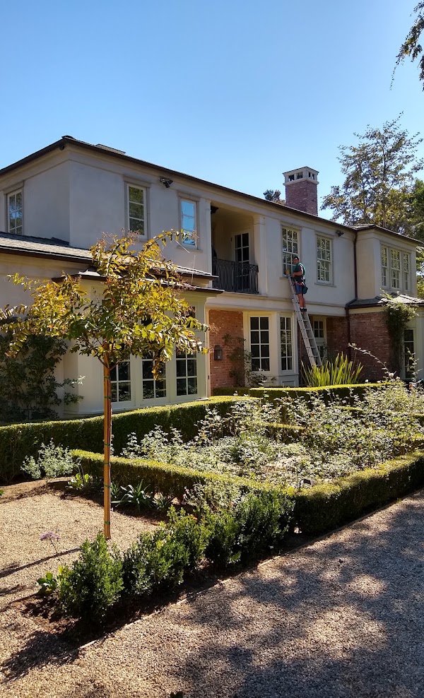Window cleaning at a two-story residential property